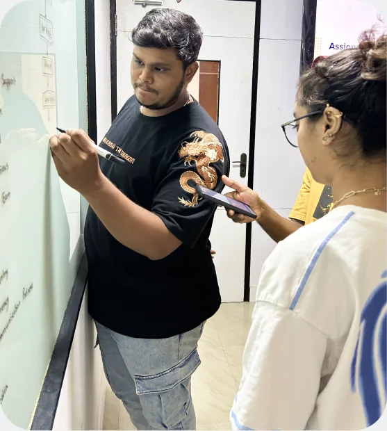 Aspira students working through a user flow on a whiteboard at the HSR Layout campus