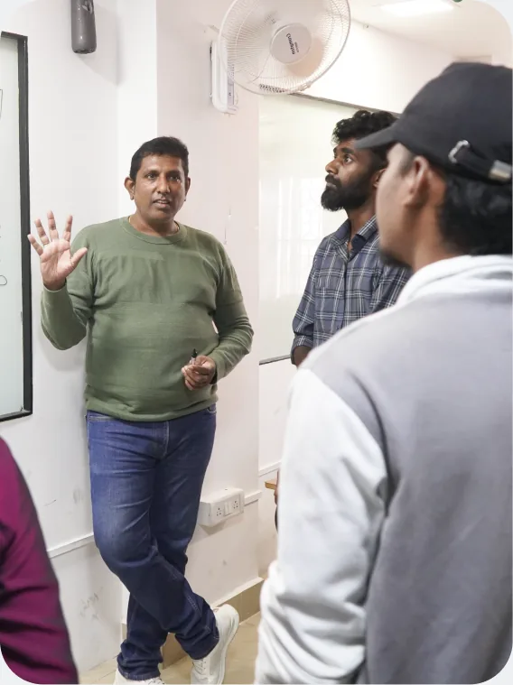 Rambal mentoring Aspira students during a studio session